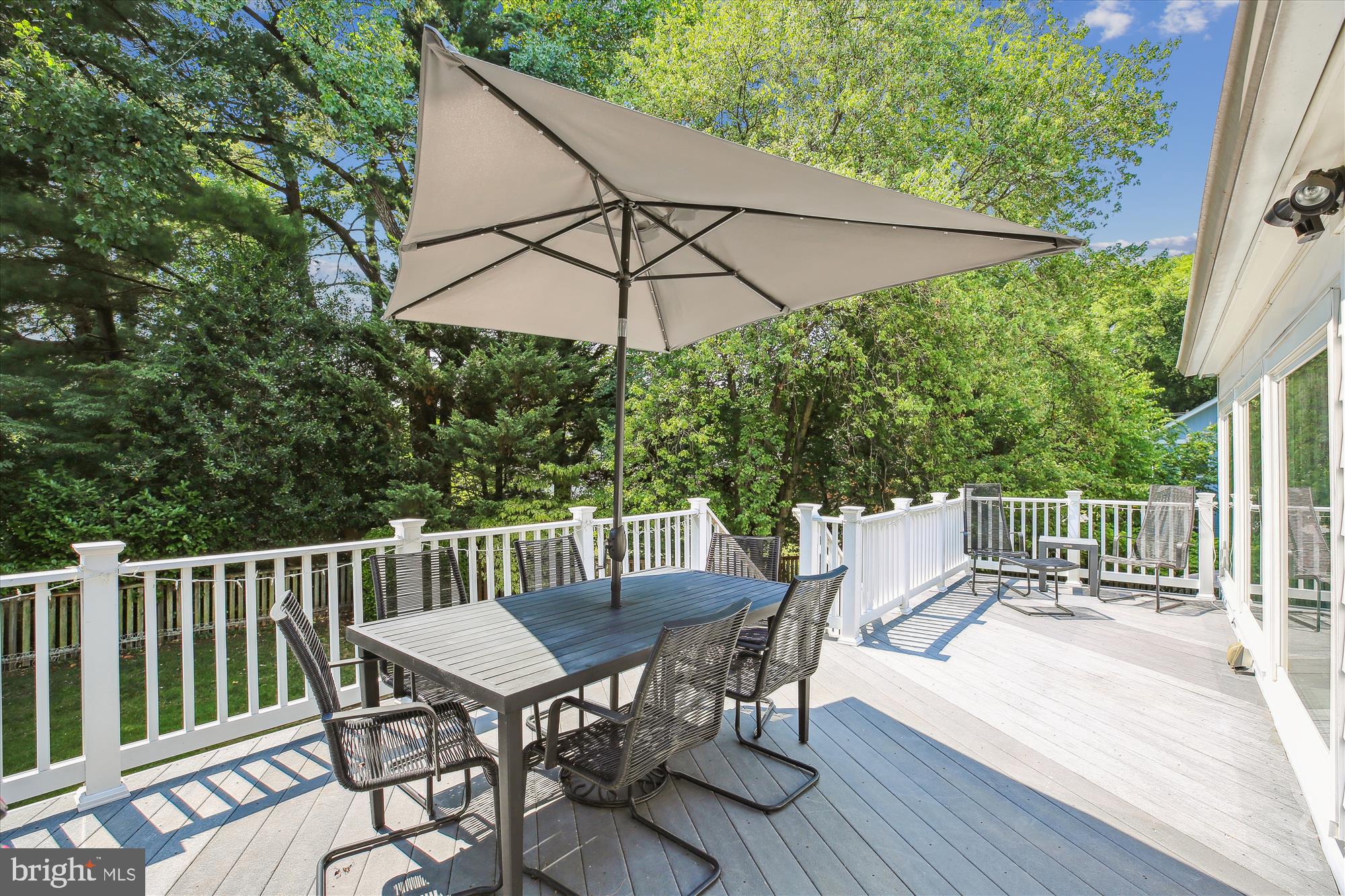 7304 Radnor Road Bethesda, MD 20817 - Photo 21 of 55 a view of balcony with furniture and umbrella