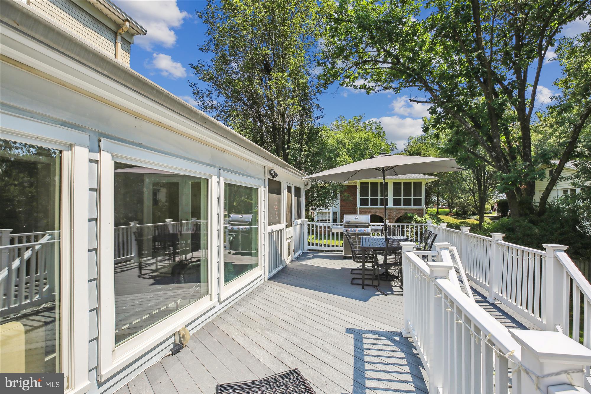 7304 Radnor Road Bethesda, MD 20817 - Photo 22 of 55 a view of a patio with chairs and table next to a yard