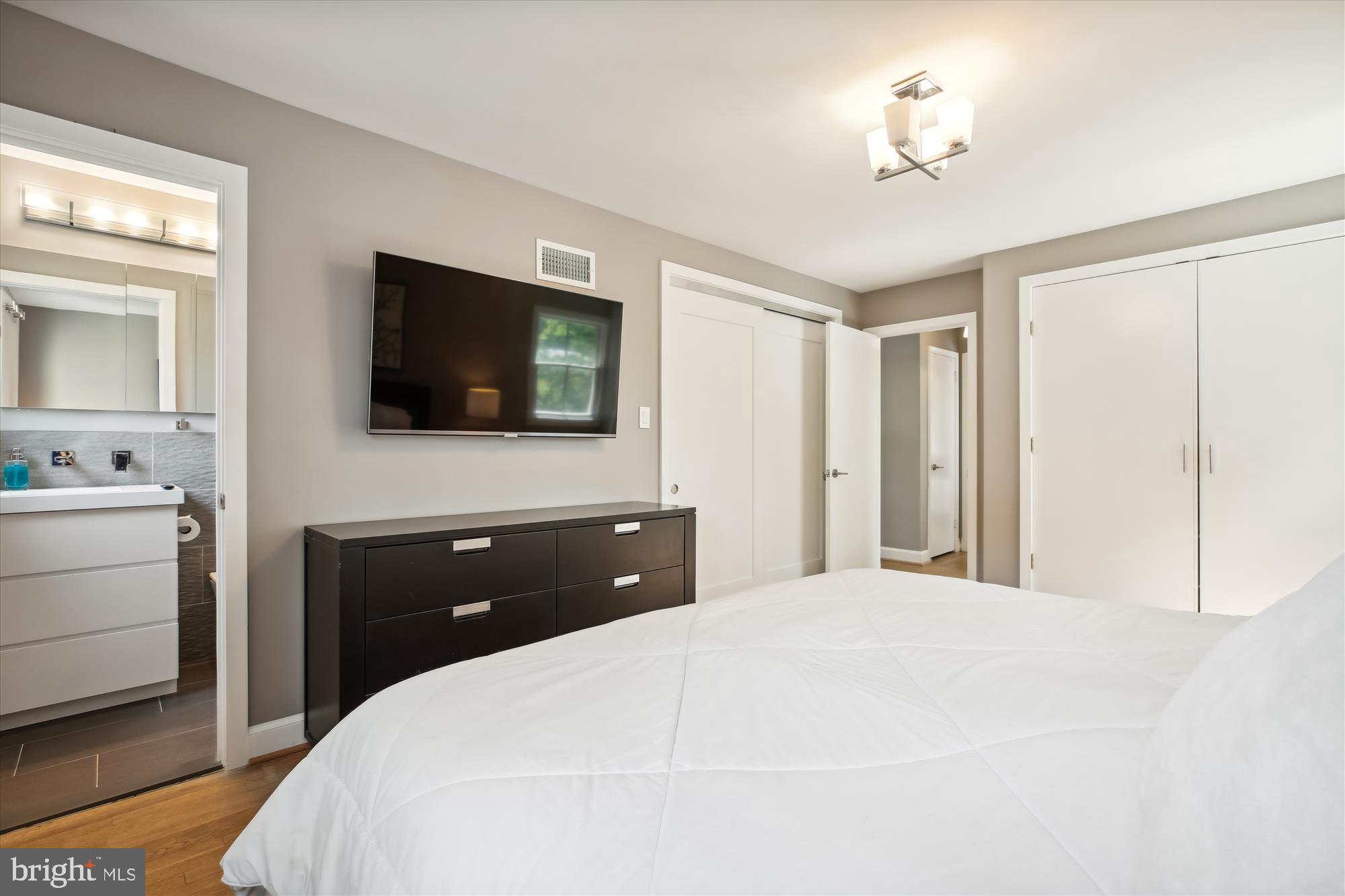 7304 Radnor Road Bethesda, MD 20817 - Photo 29 of 55 a bedroom with a bed and a flat screen tv