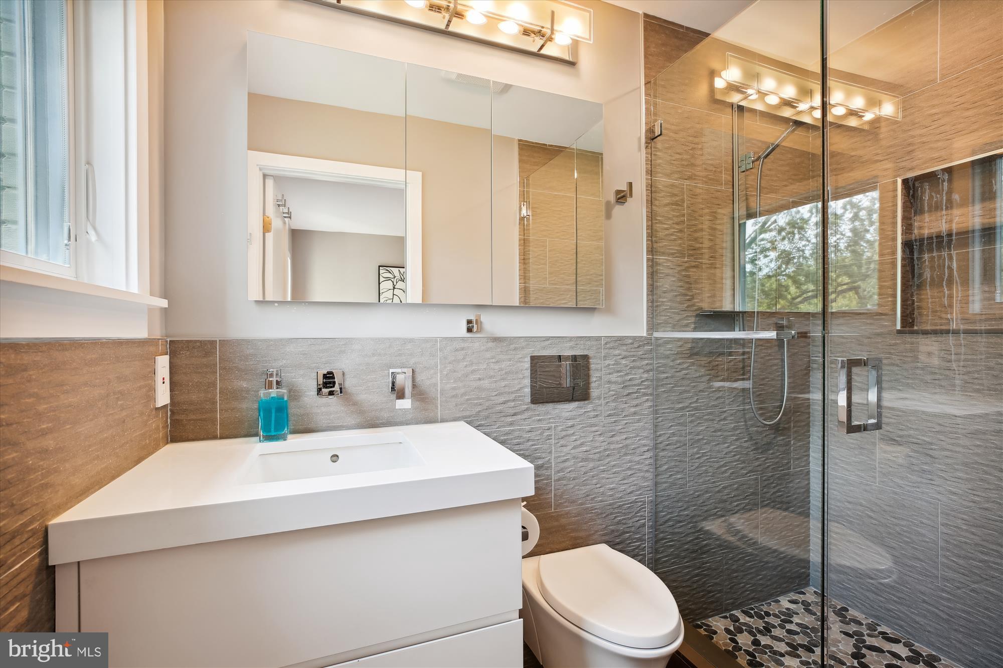 7304 Radnor Road Bethesda, MD 20817 - Photo 30 of 55 a bathroom with a sink toilet and shower