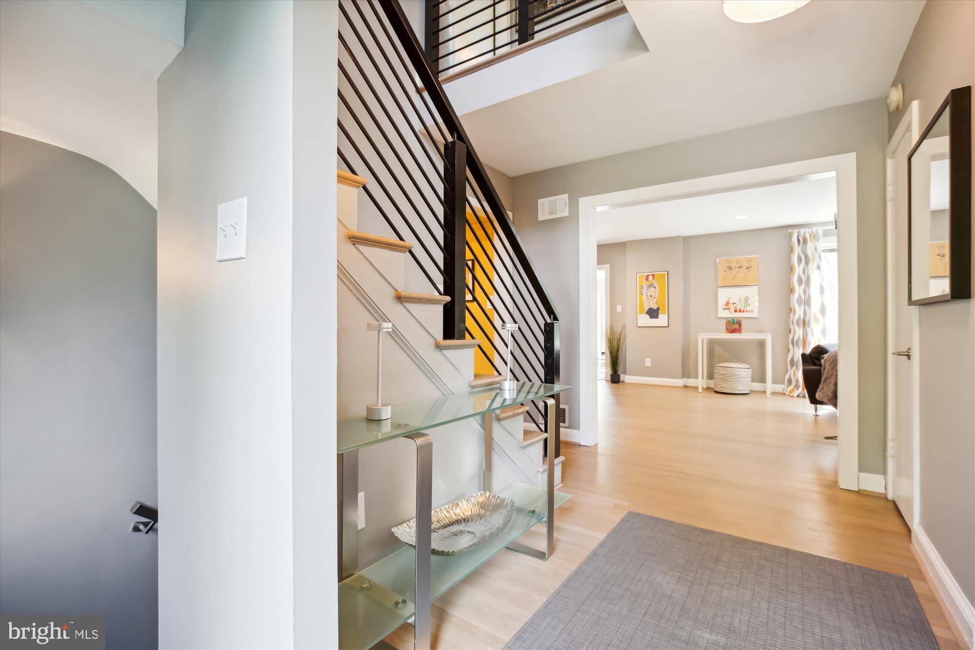 7304 Radnor Road Bethesda, MD 20817 - Photo 3 of 55 a view of an entryway with wooden floor and a livingroom view
