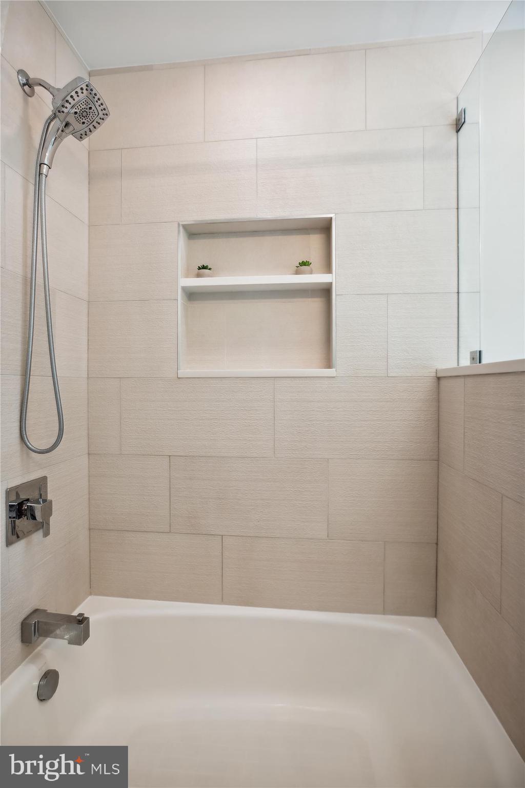 7304 Radnor Road Bethesda, MD 20817 - Photo 39 of 55 a bathroom with a shower and a bathtub