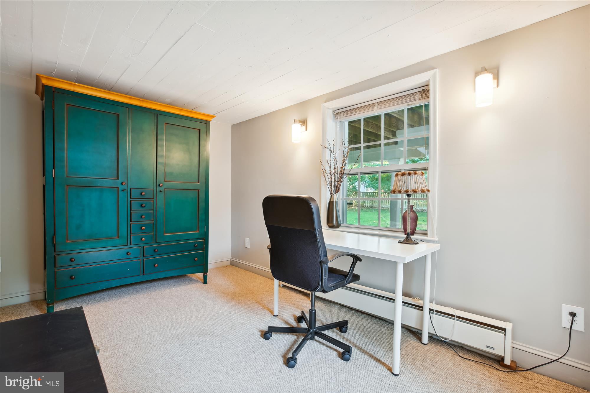 7304 Radnor Road Bethesda, MD 20817 - Photo 45 of 55 a view of a workspace with furniture and a window