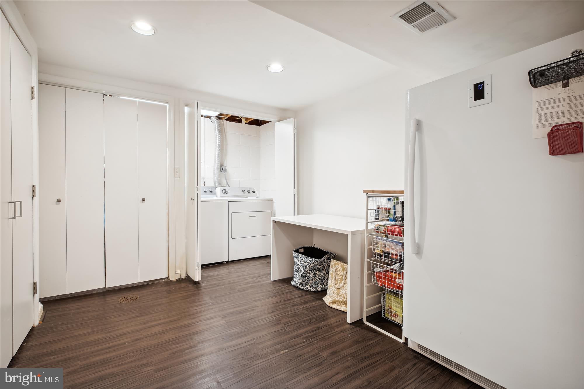 7304 Radnor Road Bethesda, MD 20817 - Photo 48 of 55 a view of empty room with wooden floor and fireplace
