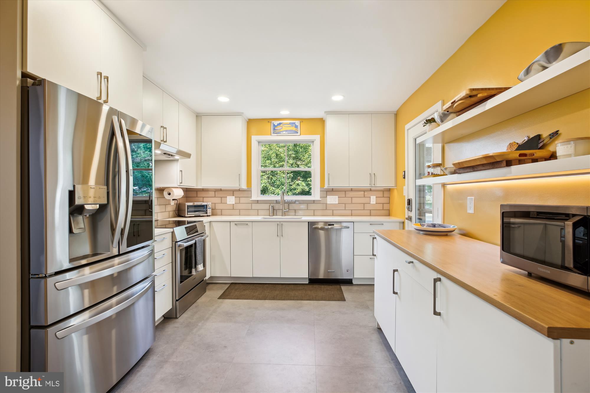 7304 Radnor Road Bethesda, MD 20817 - Photo 5 of 55 a kitchen with a sink stainless steel appliances and window