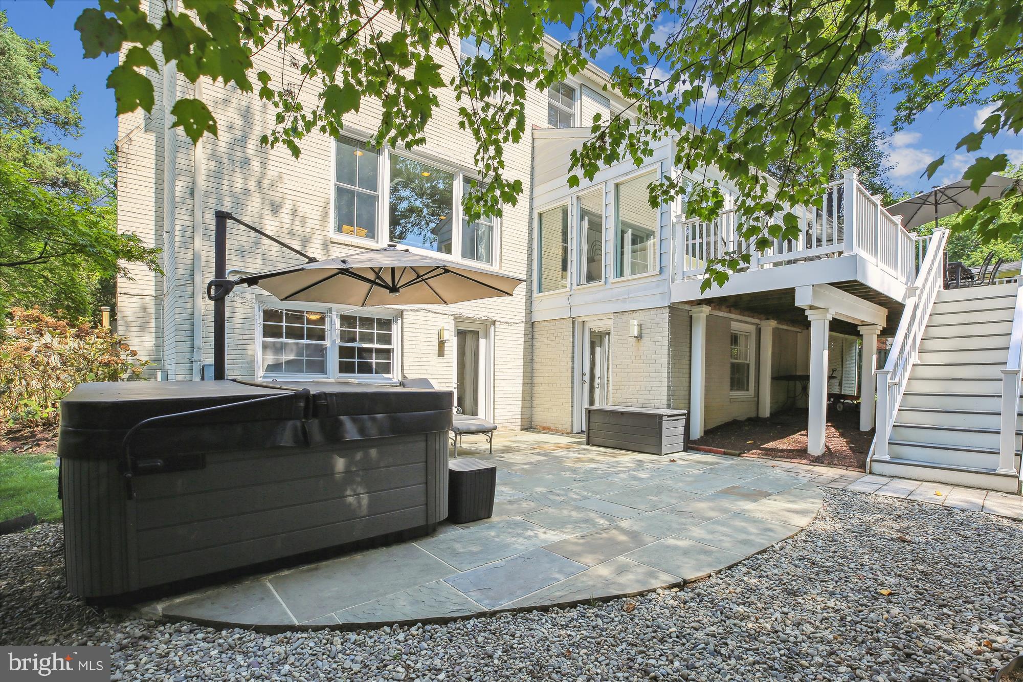 7304 Radnor Road Bethesda, MD 20817 - Photo 51 of 55 a front view of a house with a yard and garage
