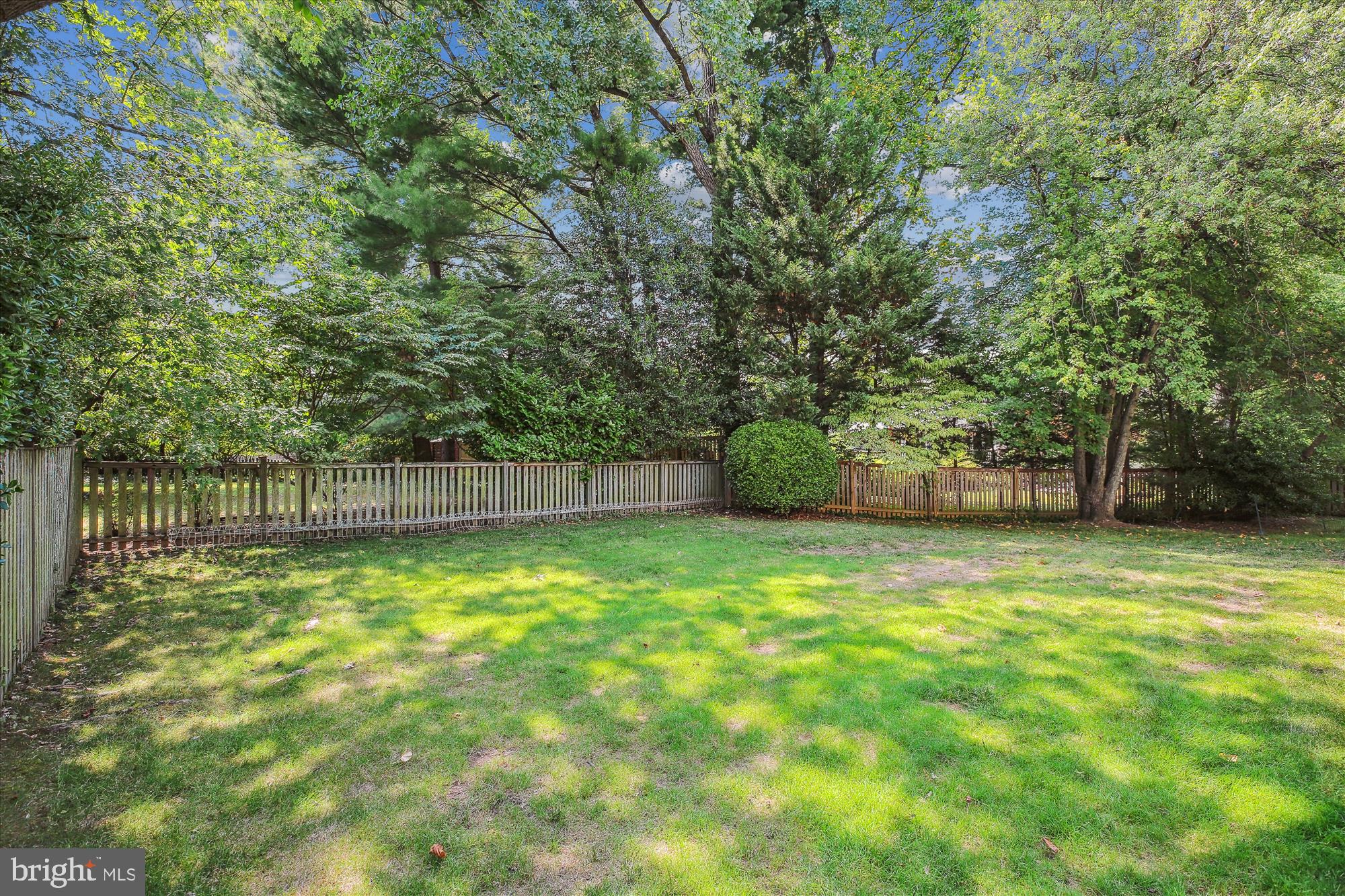 7304 Radnor Road Bethesda, MD 20817 - Photo 54 of 55 a swimming pool with trees in the background