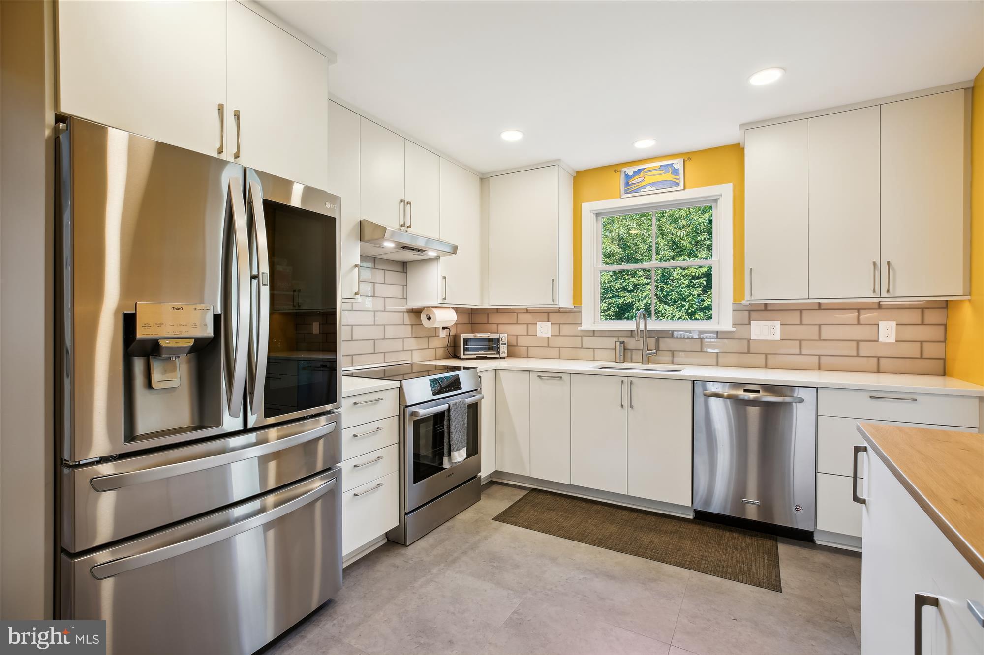 7304 Radnor Road Bethesda, MD 20817 - Photo 6 of 55 a kitchen with granite countertop stainless steel appliances and window
