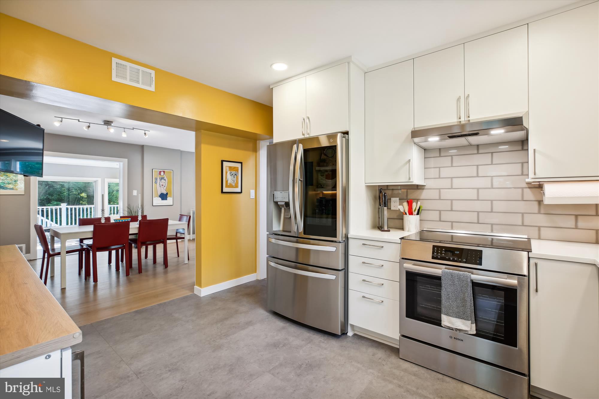 7304 Radnor Road Bethesda, MD 20817 - Photo 9 of 55 a kitchen with stainless steel appliances granite countertop a stove and a refrigerator