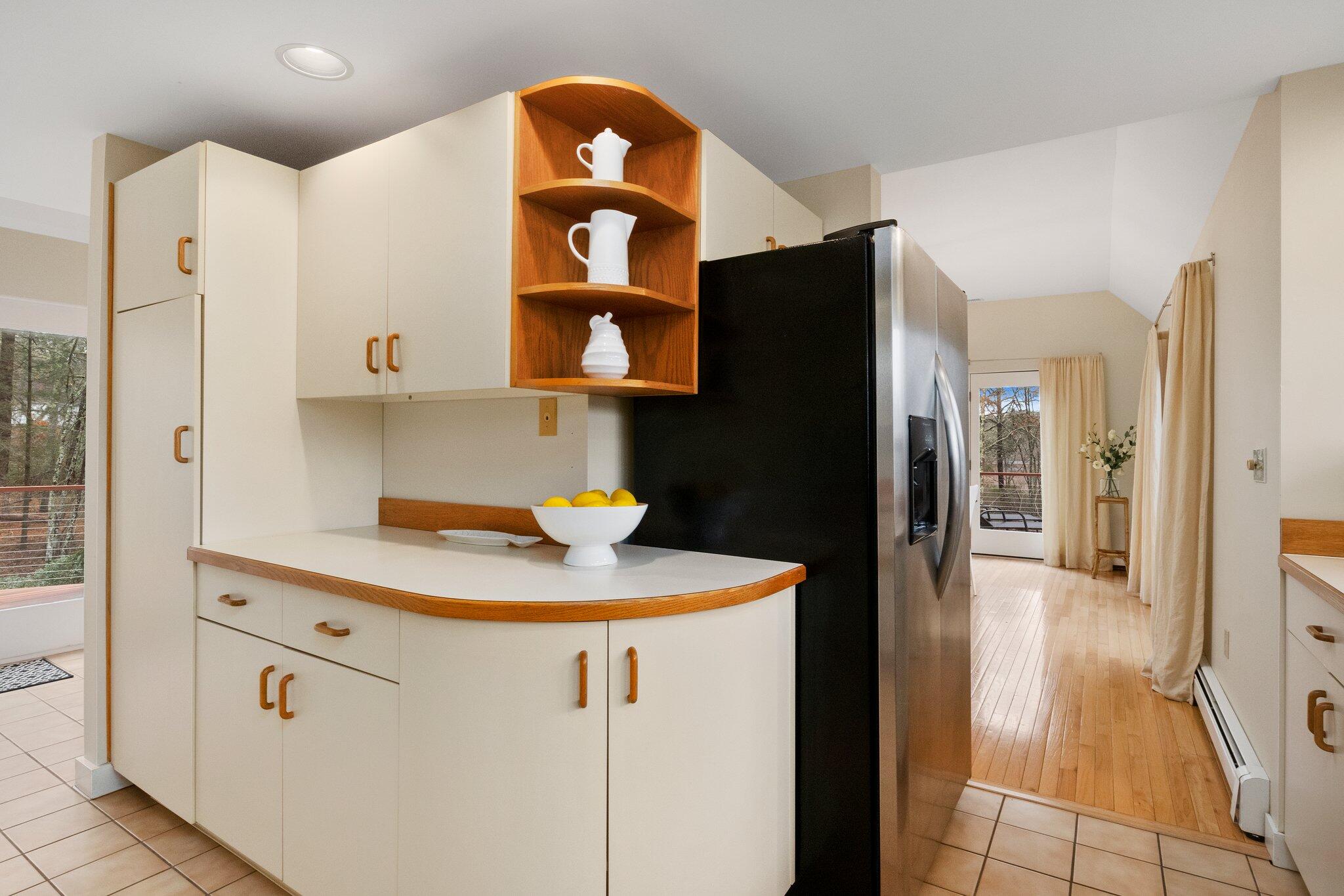47 Babbling Brook Road Centerville, MA 02632 - Photo 17 of 36 a kitchen with stainless steel appliances a refrigerator and a stove