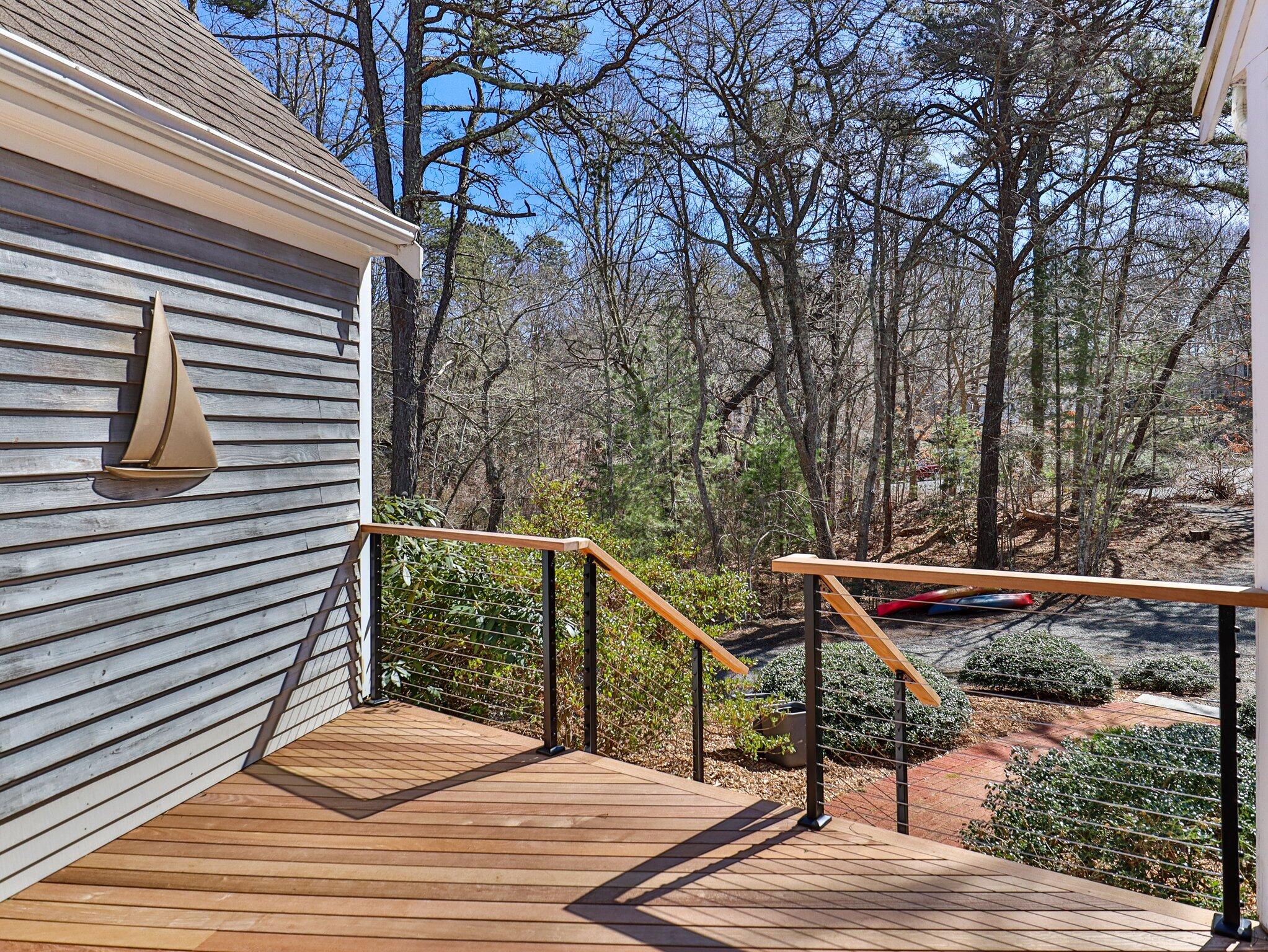 47 Babbling Brook Road Centerville, MA 02632 - Photo 6 of 36 a view of balcony with wooden floor and seating space