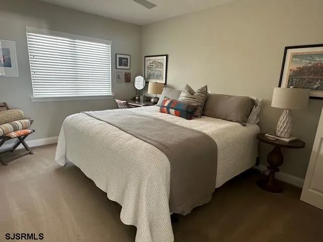 a bedroom with bed and a window