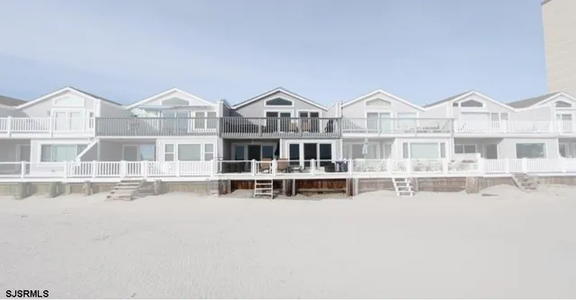 a view of house with a large windows and a big yard