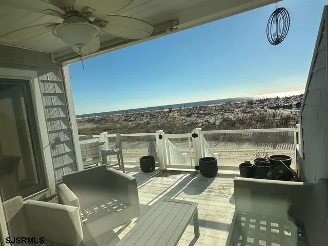 a view of a balcony with chair and table