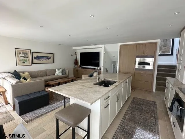 a kitchen with a stove a sink and a refrigerator