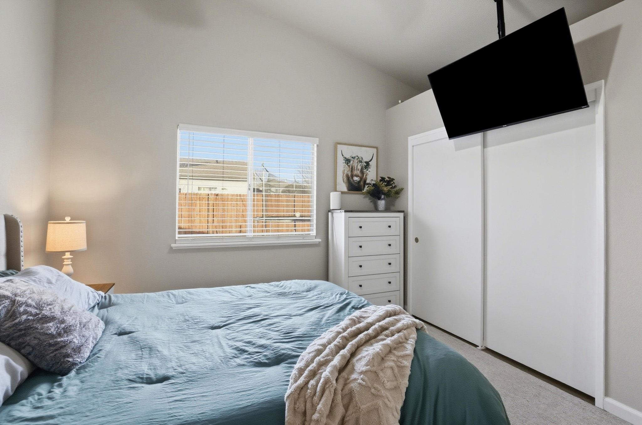 799 Morgans Ranch Circle Galt, CA 95632 - Photo 18 of 36 Carpeted bedroom featuring a closet and vaulted ceiling