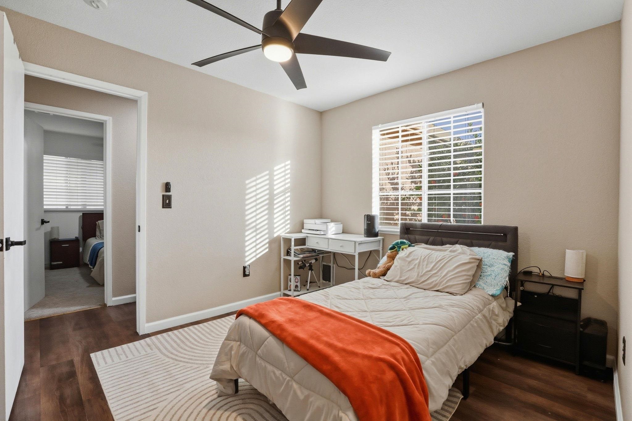 799 Morgans Ranch Circle Galt, CA 95632 - Photo 21 of 36 Bedroom featuring dark wood-style flooring and a ceiling fan