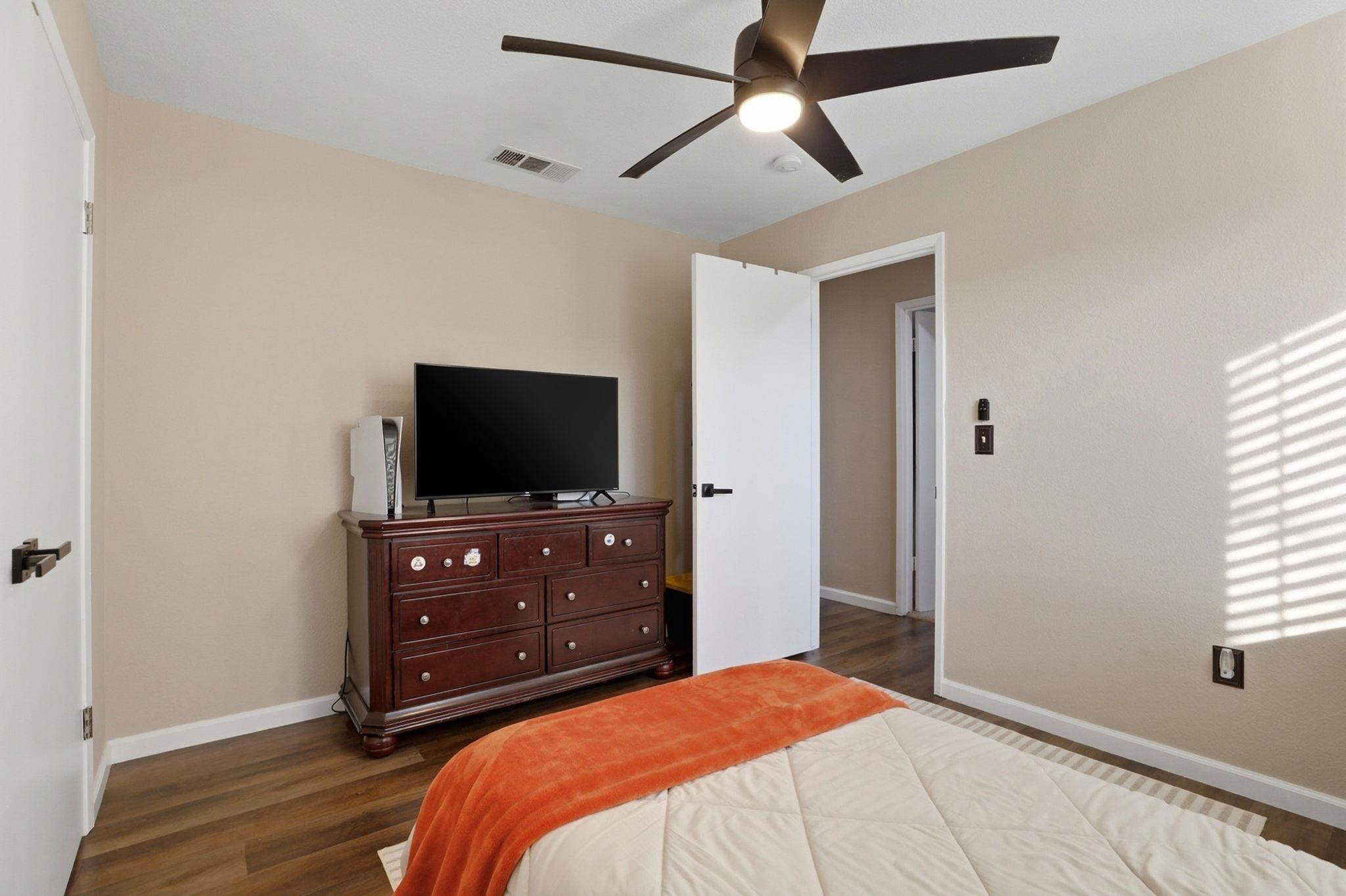 799 Morgans Ranch Circle Galt, CA 95632 - Photo 22 of 36 Bedroom featuring dark wood-type flooring and a ceiling fan
