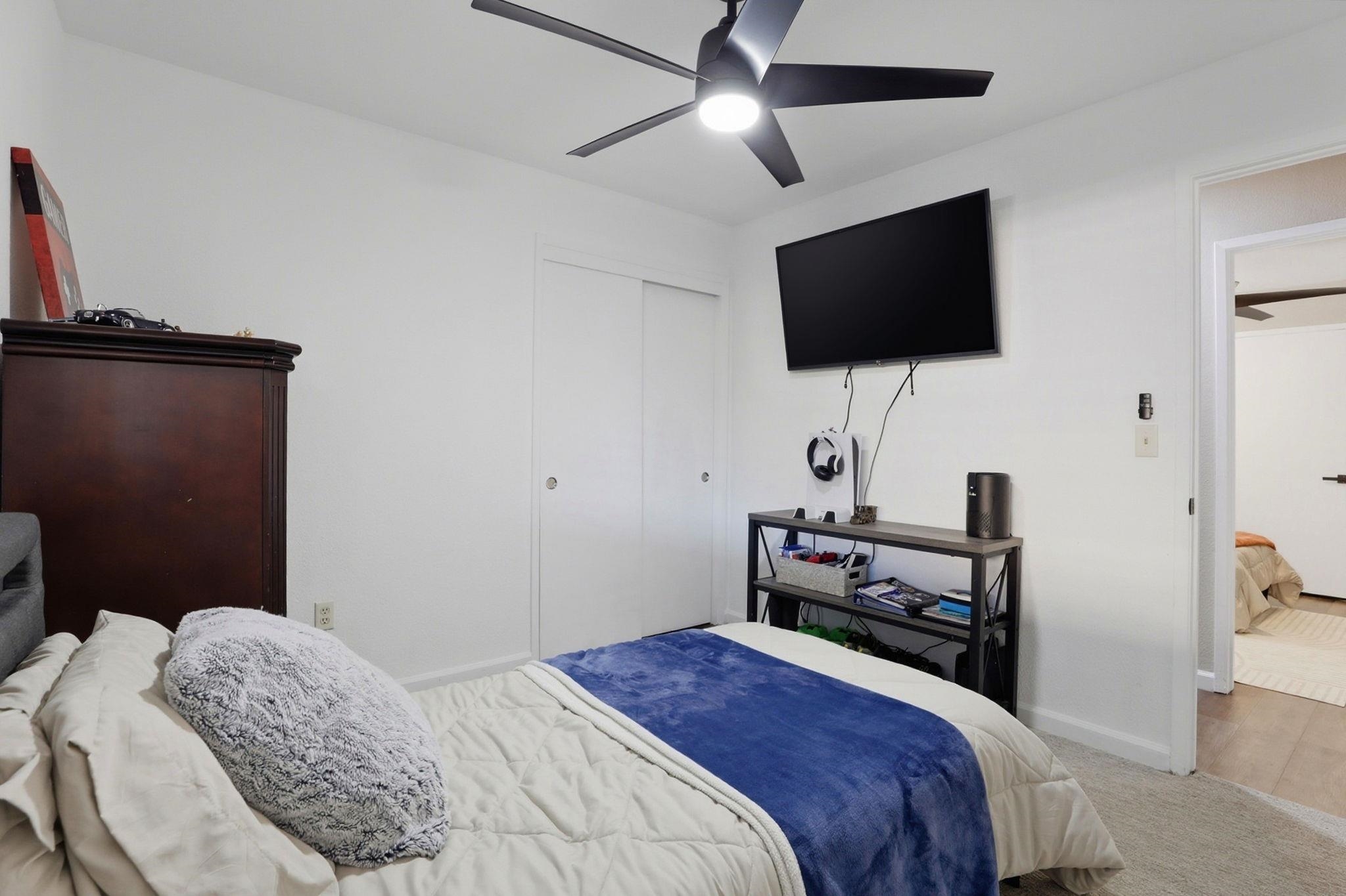 799 Morgans Ranch Circle Galt, CA 95632 - Photo 24 of 36 Bedroom with carpet flooring, ceiling fan, and a closet