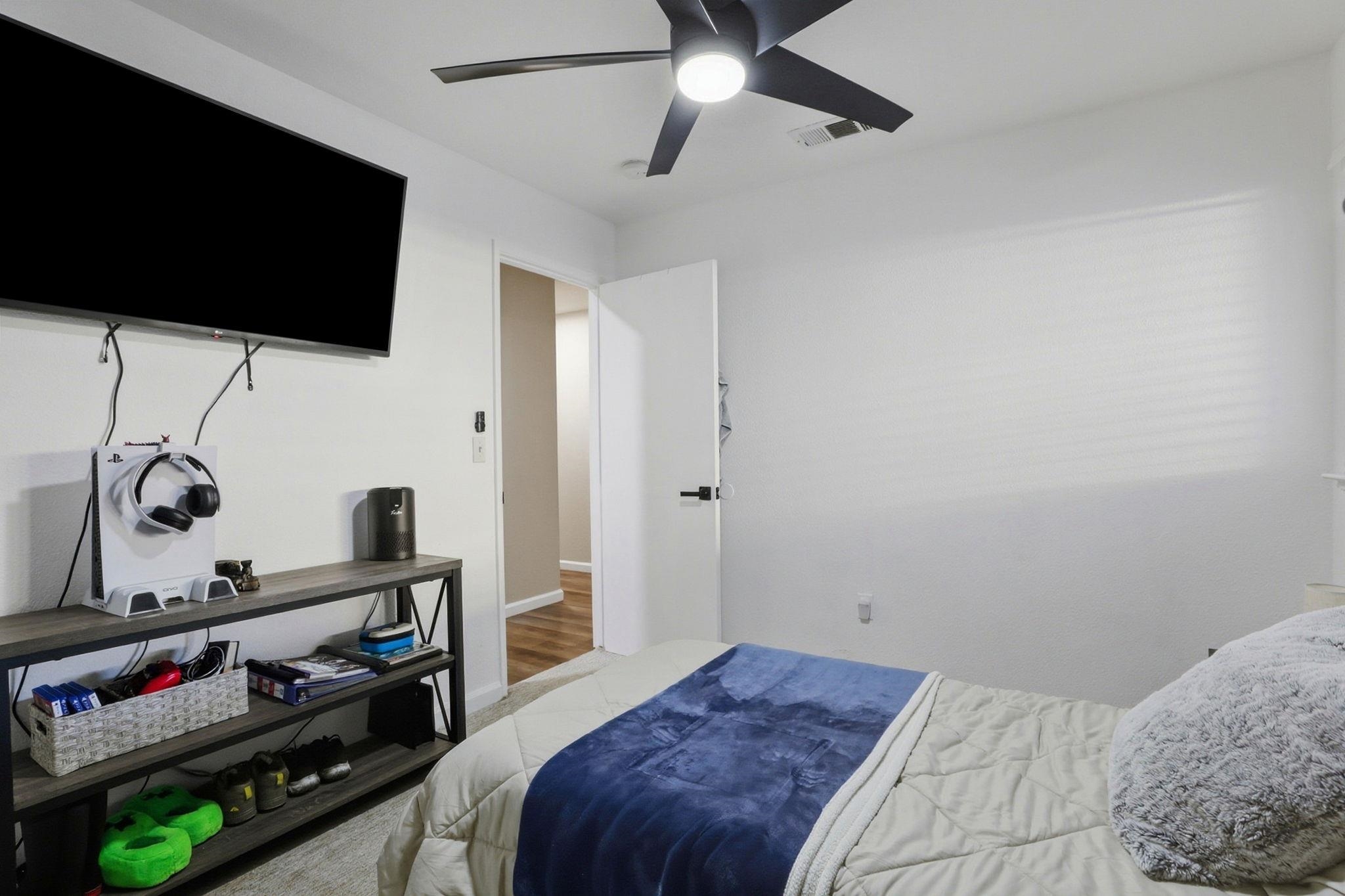 799 Morgans Ranch Circle Galt, CA 95632 - Photo 25 of 36 Bedroom featuring a ceiling fan and wood finished floors