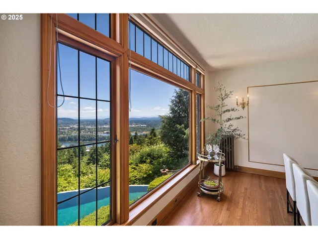 a view of a living room and a floor to ceiling window