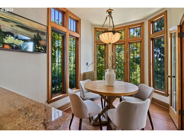 a view of a dining room with furniture window and outside view