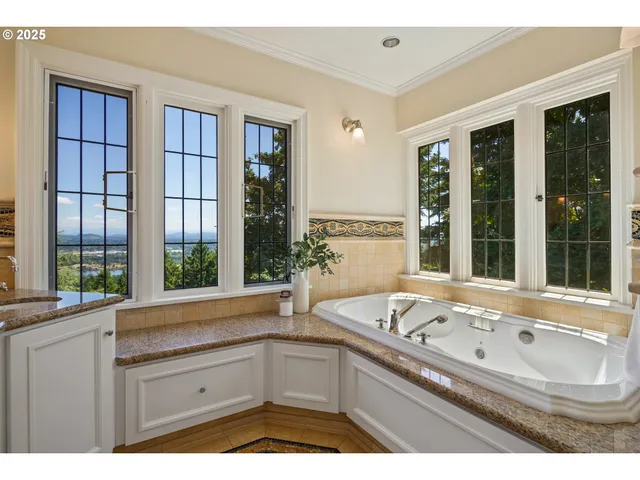 a bathroom with a sink and a large window