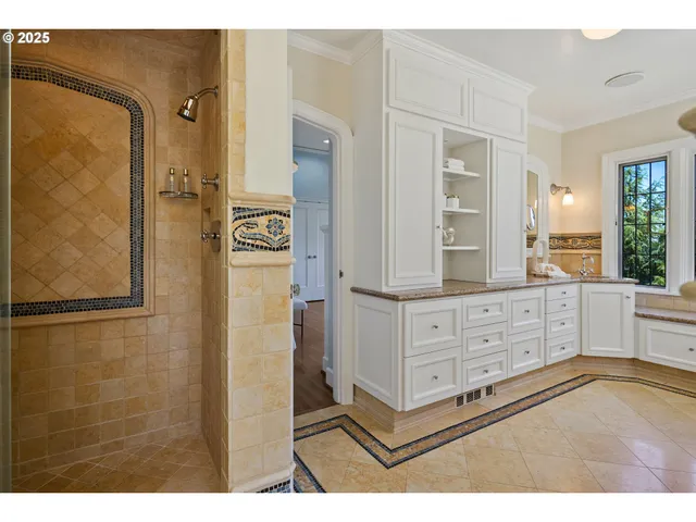 a bathroom with a shower sink and mirror