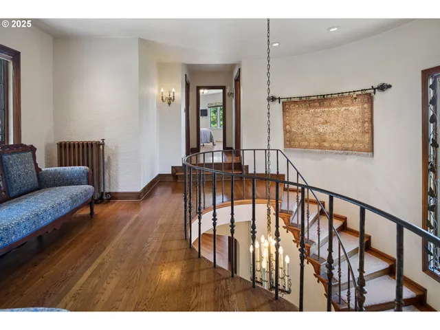 a view of living room with furniture and wooden floor