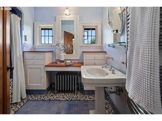 a bathroom with a sink a mirror and a toilet