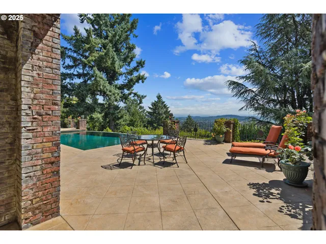 a view of swimming pool with a yard and outdoor seating
