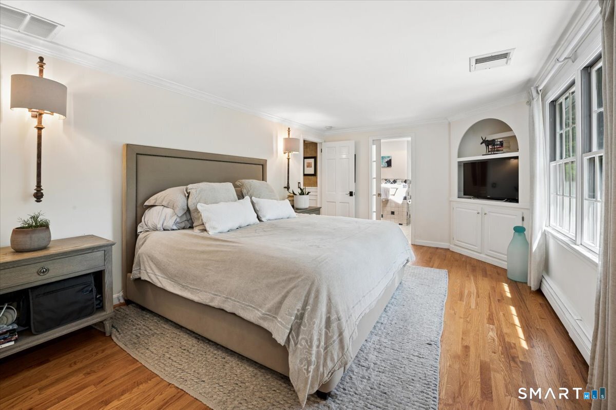 94 Vista Road Wilton, CT 06897 - Photo 22 of 38 a bedroom with a bed and a flat screen tv