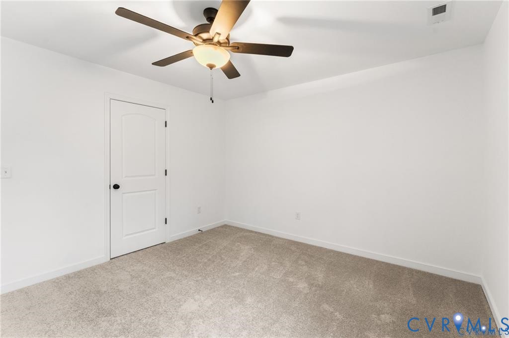 302 Musket Drive Ruther Glen, VA 22546 - Photo 20 of 27 en empty room with ceiling fan