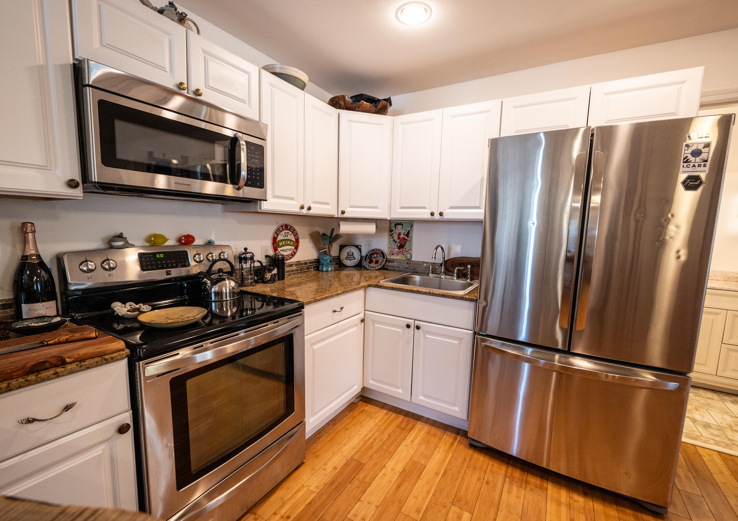 1124 Catherine Street, Unit 202 Key West, FL 33040 - Photo 9 of 22 a kitchen with stainless steel appliances a refrigerator microwave and sink