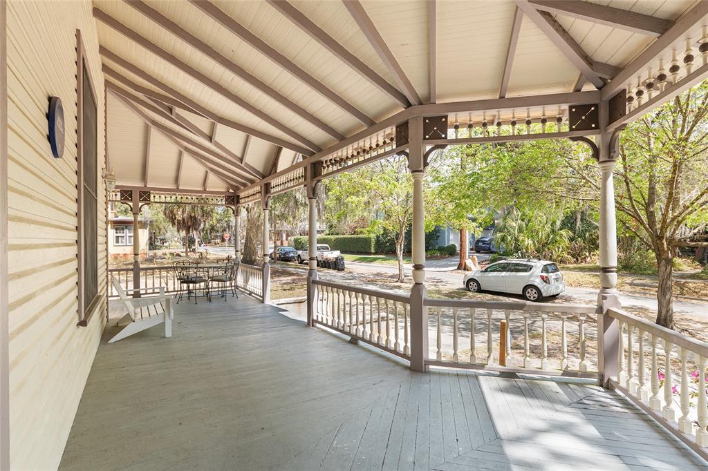 306 Northeast 3rd Street Gainesville, FL 32601 - Photo 13 of 88 a view of a porch with furniture and floor to ceiling window