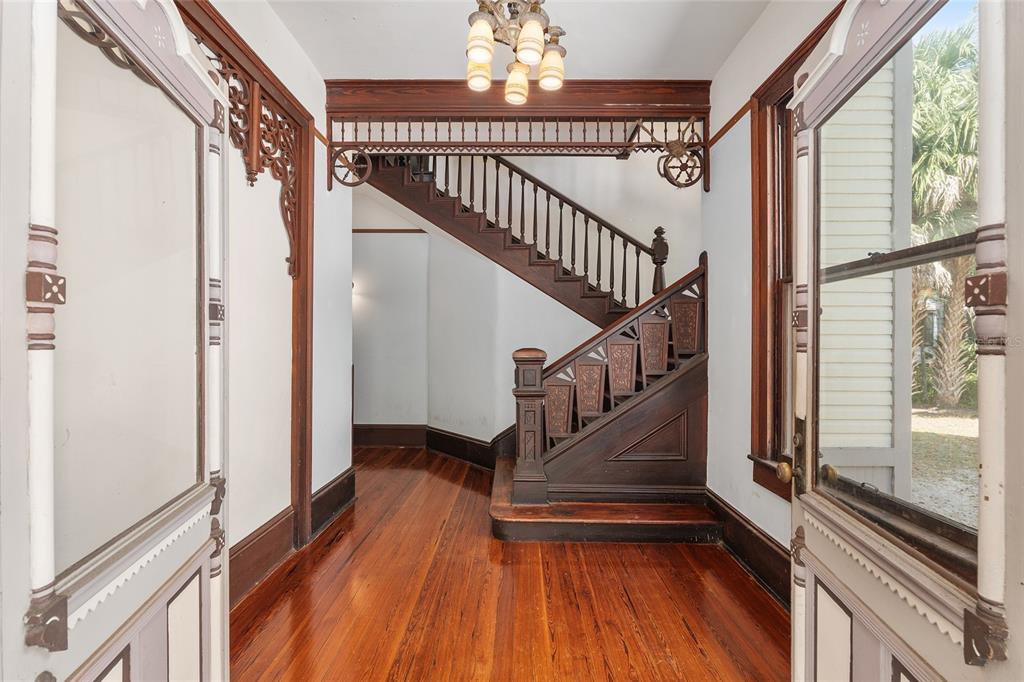 306 Northeast 3rd Street Gainesville, FL 32601 - Photo 15 of 88 a view of entryway and hall with wooden floor