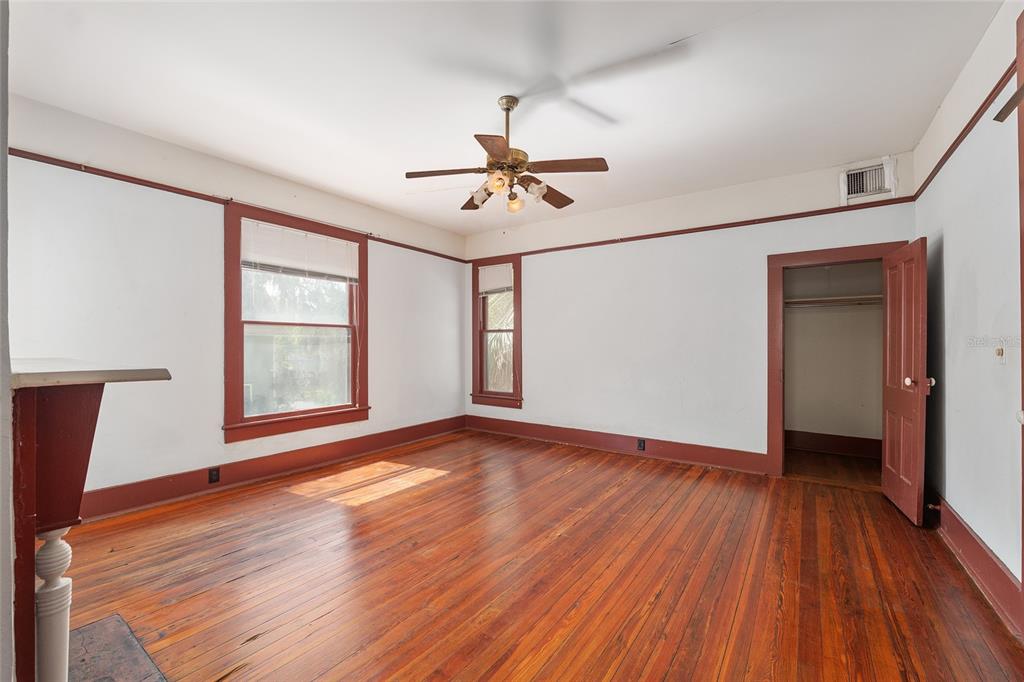 306 Northeast 3rd Street Gainesville, FL 32601 - Photo 35 of 88 wooden floor in an empty room with a window