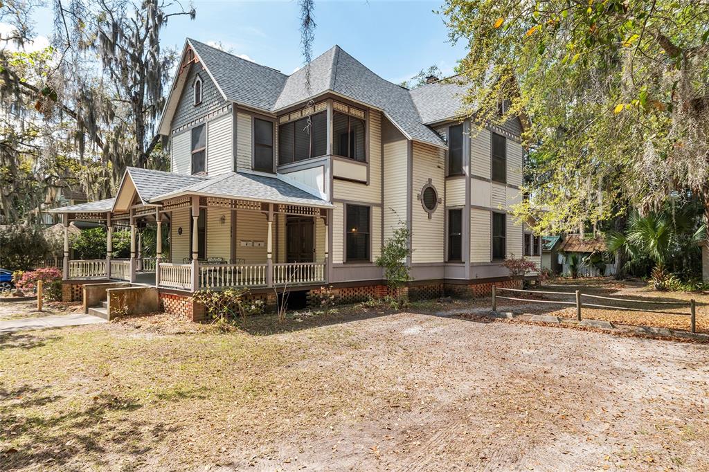 306 Northeast 3rd Street Gainesville, FL 32601 - Photo 4 of 88 a front view of a house with a yard covered with snow in the background