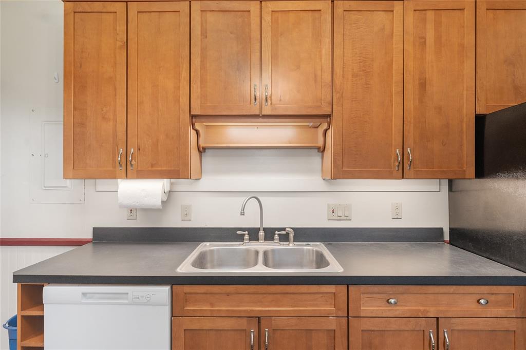 306 Northeast 3rd Street Gainesville, FL 32601 - Photo 51 of 88 a kitchen with a sink cabinets and stainless steel appliances