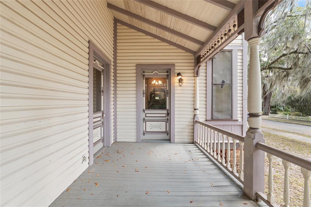 306 Northeast 3rd Street Gainesville, FL 32601 - Photo 63 of 88 a view of a porch with wooden floor and fence