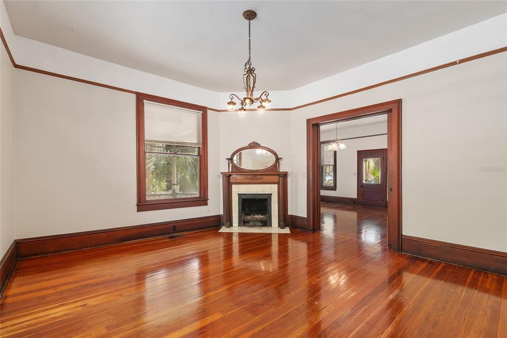 306 Northeast 3rd Street Gainesville, FL 32601 - Photo 66 of 88 a view of a livingroom with wooden floor fireplace and window
