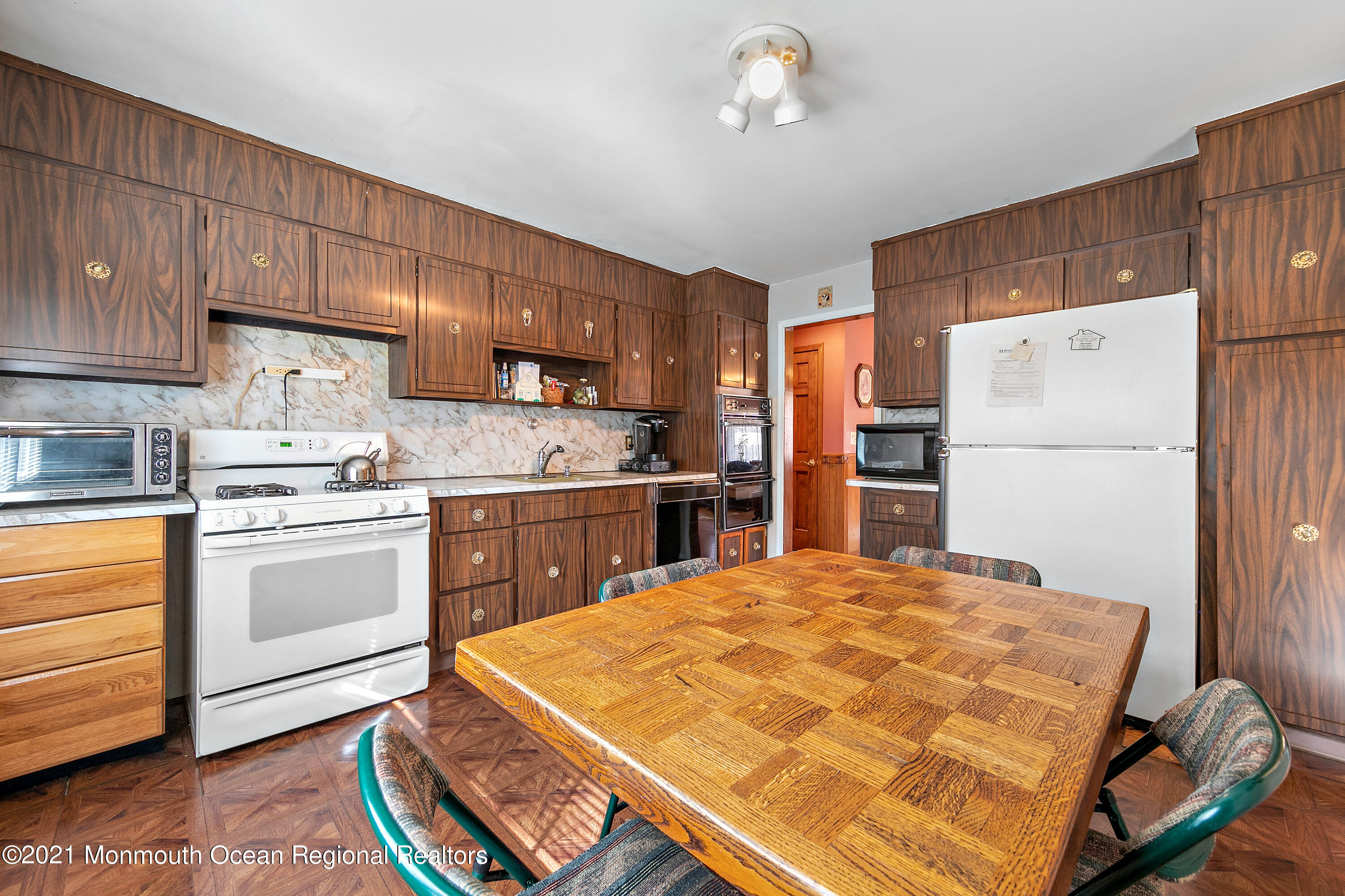 550 South Cooks Bridge Road Jackson, NJ 08527 - Photo 12 of 39 a kitchen with a refrigerator and a stove top oven