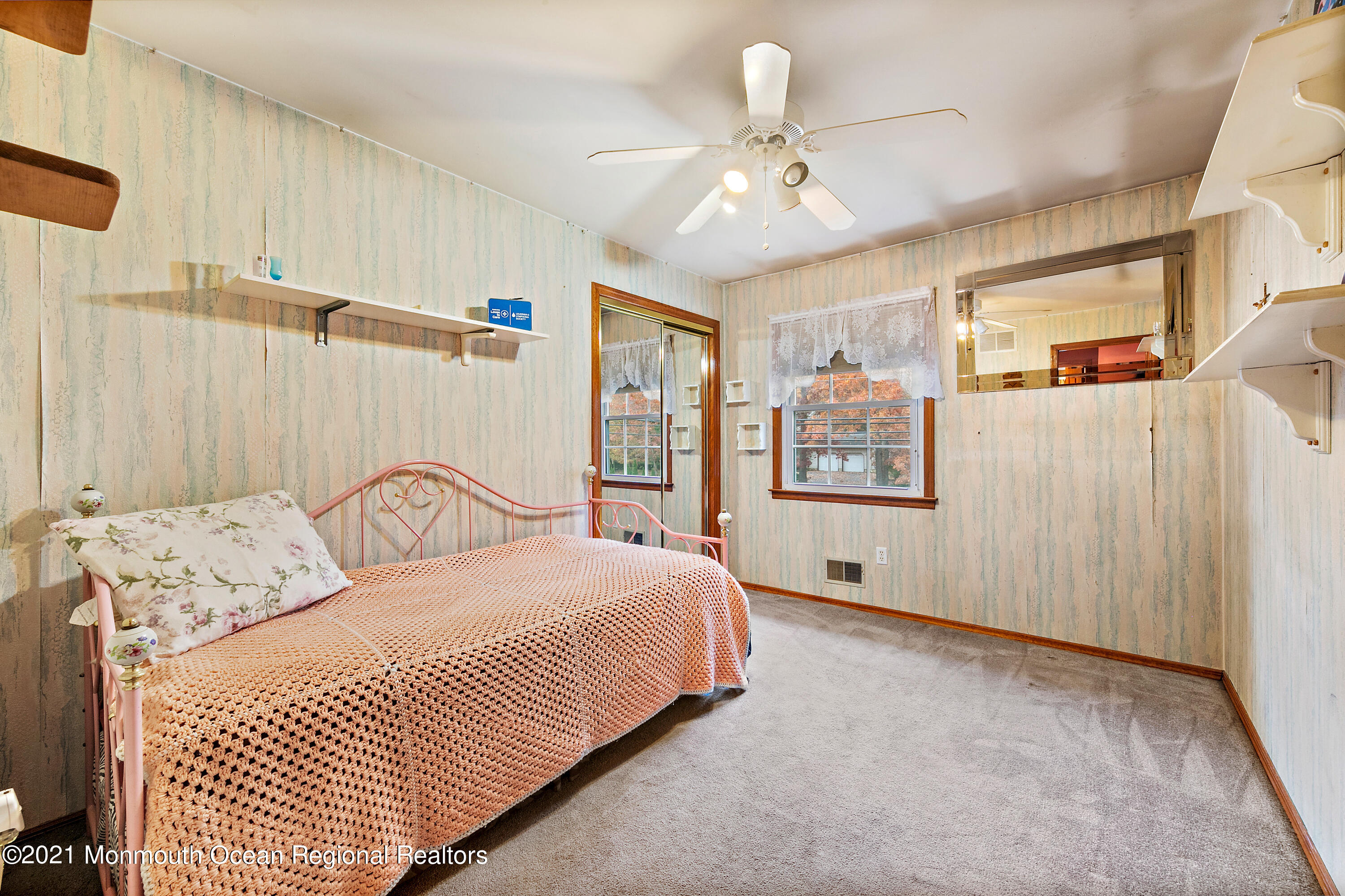 550 South Cooks Bridge Road Jackson, NJ 08527 - Photo 14 of 39 a bedroom with a large bed and a chandelier