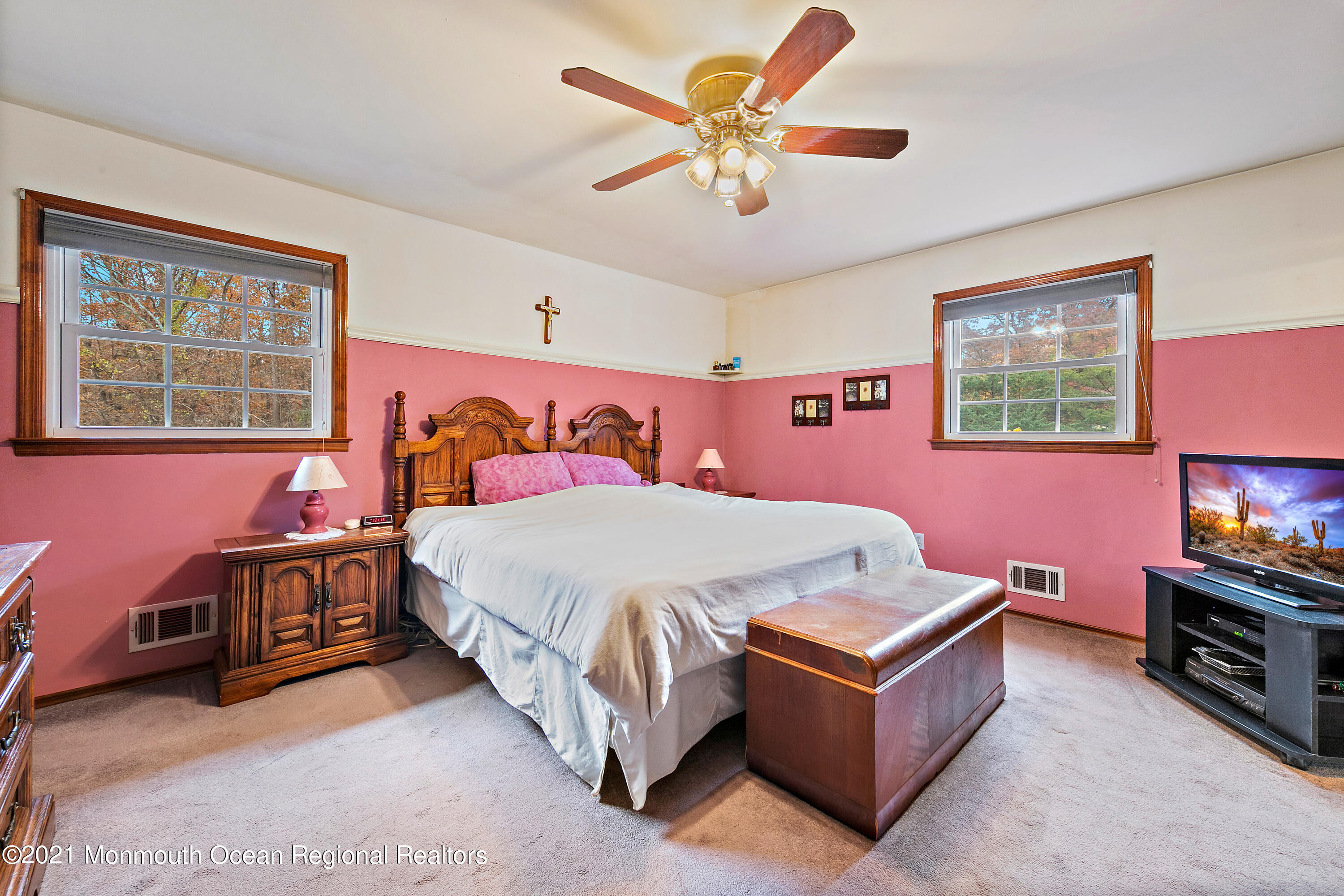 550 South Cooks Bridge Road Jackson, NJ 08527 - Photo 18 of 39 a bedroom with a bed and a chandelier