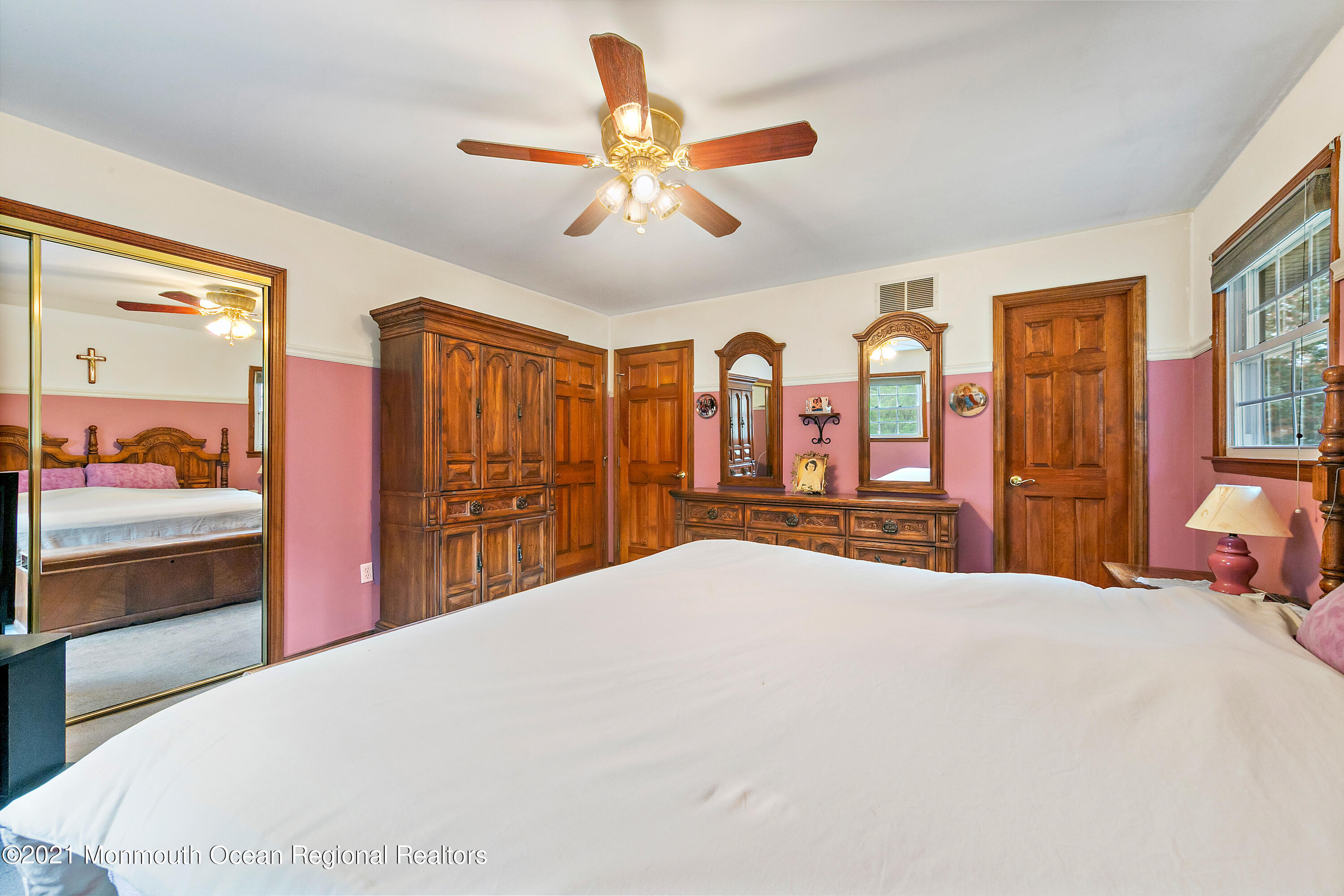 550 South Cooks Bridge Road Jackson, NJ 08527 - Photo 20 of 39 a bedroom with a large bed and a chandelier