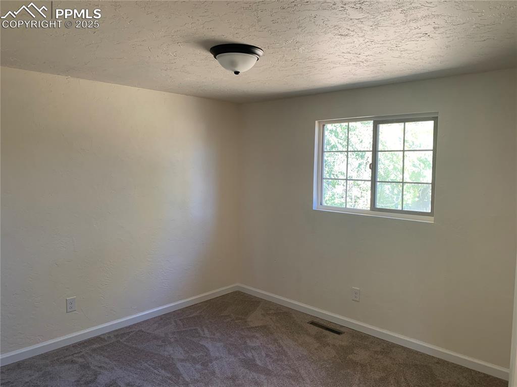 1057 Peterson Road Colorado Springs, CO 80915 - Photo 15 of 32 Primary Bedroom