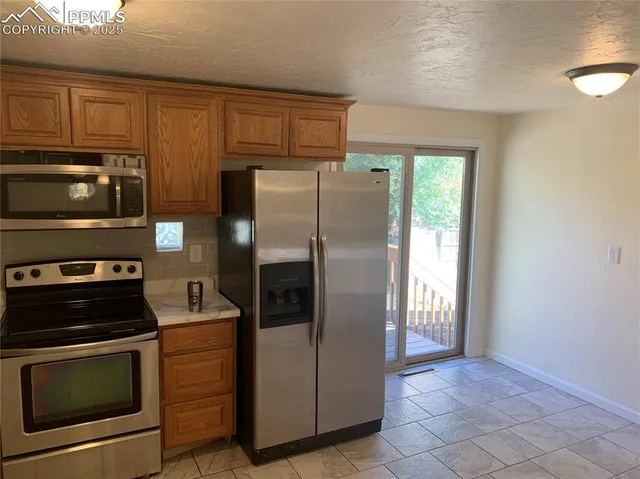 $359,900 | 1057 Peterson Road, Colorado Springs, CO 80915