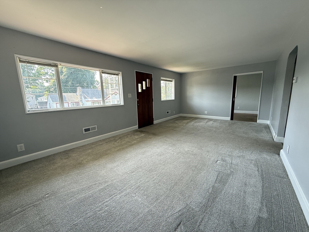 36 5th Avenue Lowell, MA 01854 - Photo 9 of 16 an empty room with windows