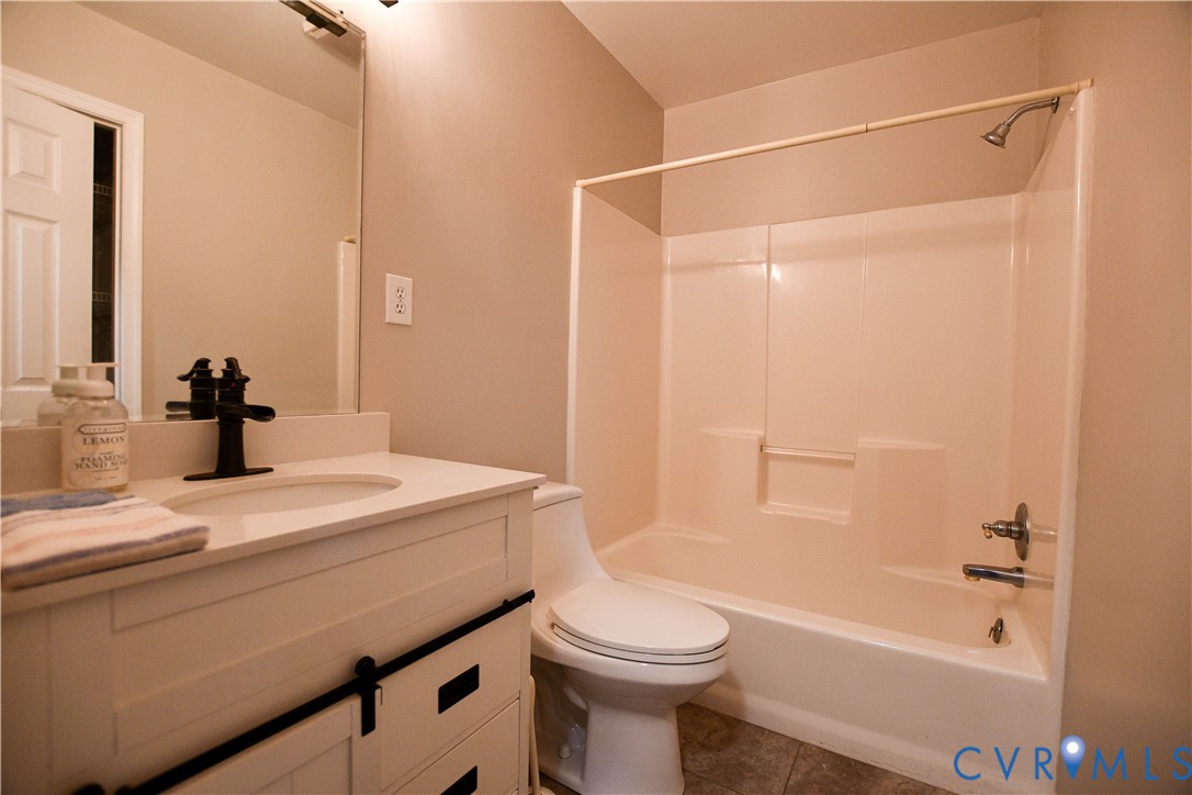 153 Deer Trail Aylett, VA 23009 - Photo 12 of 50 a bathroom with a sink a toilet and shower