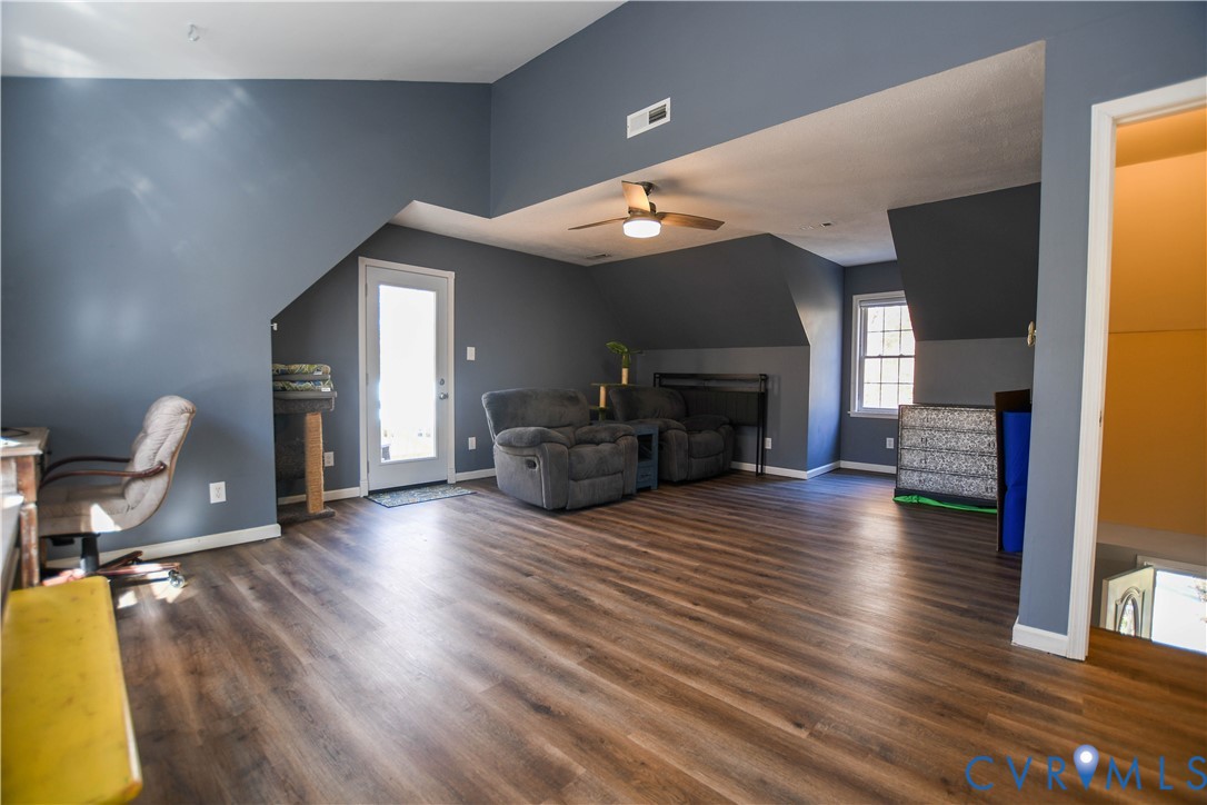 153 Deer Trail Aylett, VA 23009 - Photo 15 of 50 a living room with fireplace furniture and a wooden floor